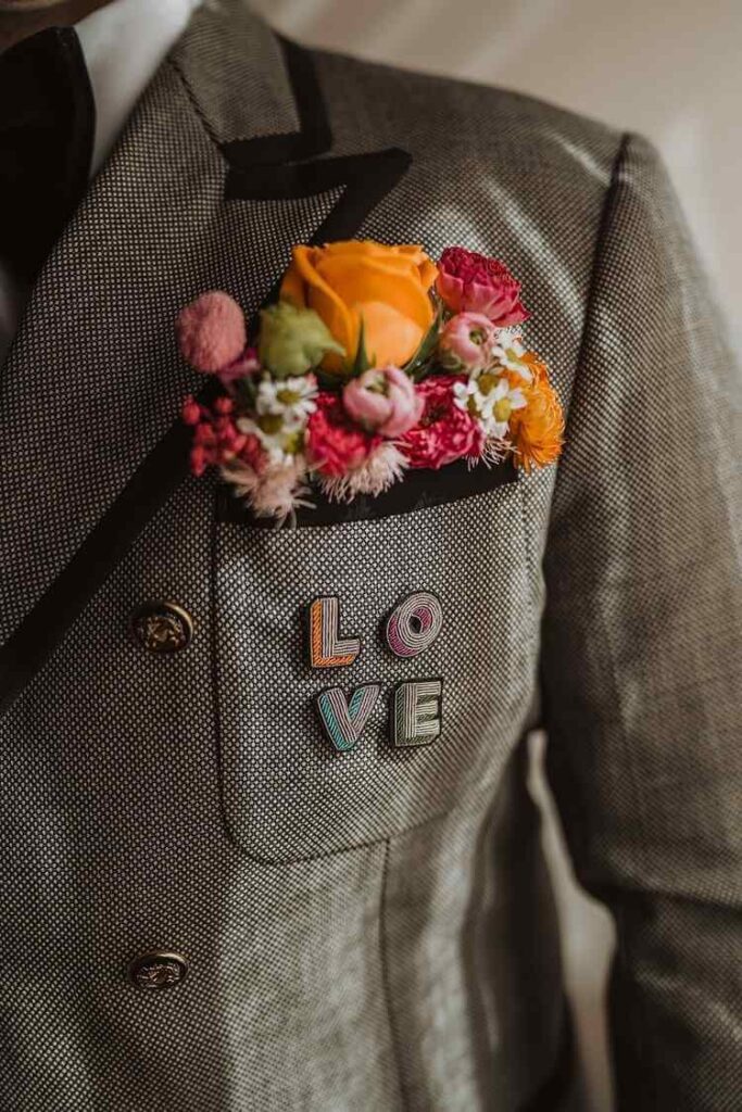 Coloured flowers in groom’s pocket