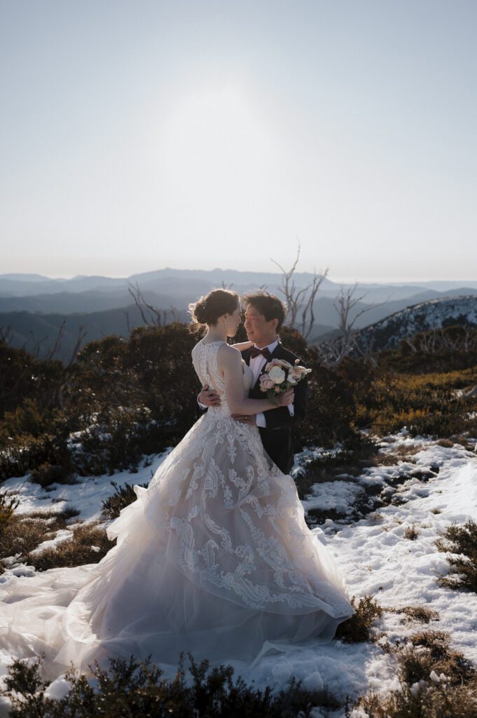 Couple hugging in snow